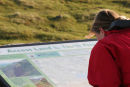 06-5128 Female Walker and Access Land Information Board, Cow Green Reservoir, Upper Teesdale, County Durham